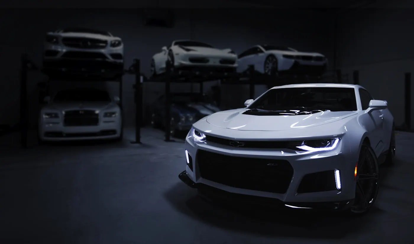 Cars in a clean garage at night
